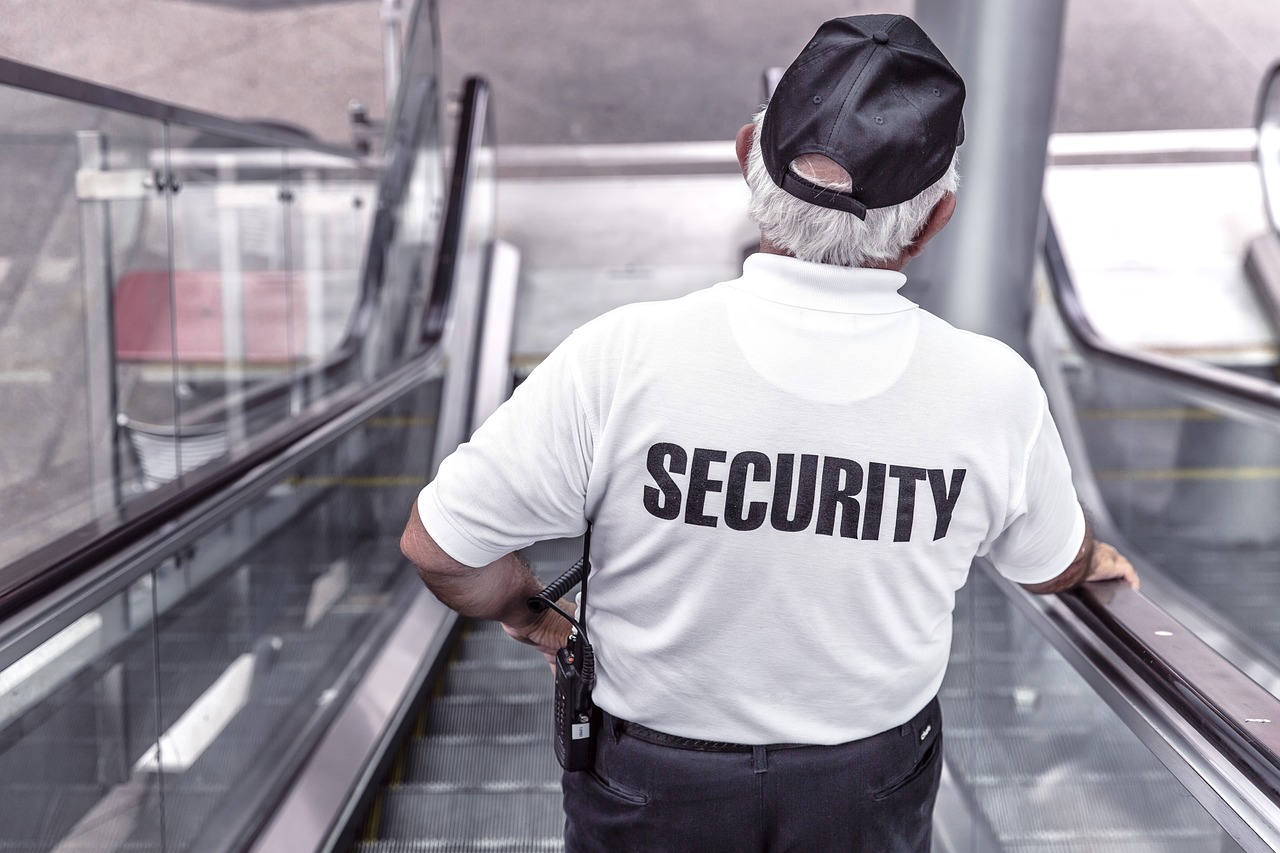 security officer monitoring surveillance screens